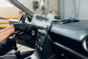 picture showing steam cleaning of vehicles